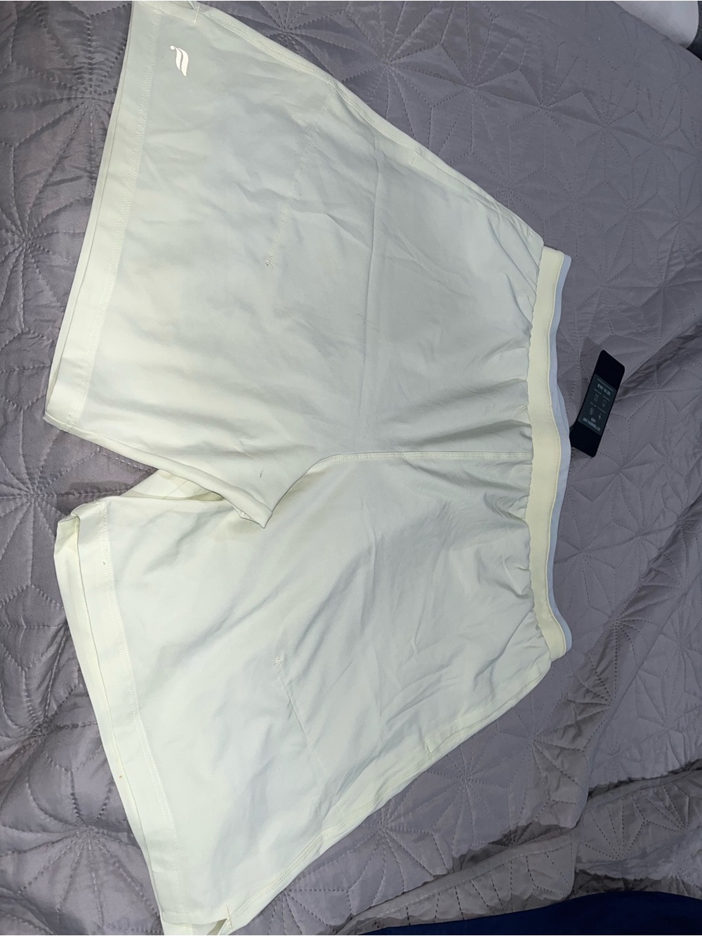 Men’s athletic shorts with compression shorts underneath